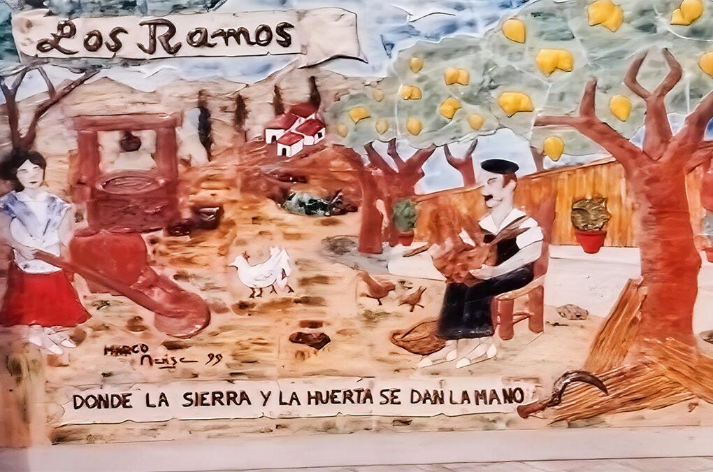 Antiguo mural en la entrada de Los Ramos con escena tradicional huertana y referencia a la unión entre la sierra y la huerta.
