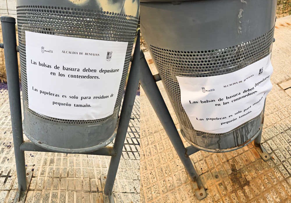 Papeleras con cartel de aviso de la campaña del alcalde de Beniaján sobre el uso correcto de las papeleras